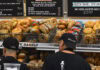 Baskets of bagels line the wall of an NYC deli
