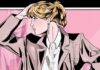 Comic illustration of a blond woman striking a pose in front of a pink backdrop. She wears red pants and a blazer with her hair in a high ponytail.