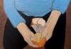 More Than Just a Fruit Painting on canvas. A figure in a cerulean sweater kneels, their face out of frame, and peels an orange.