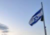 did you ever An Israeli flag at sunrise.