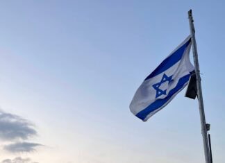 did you ever An Israeli flag at sunrise.